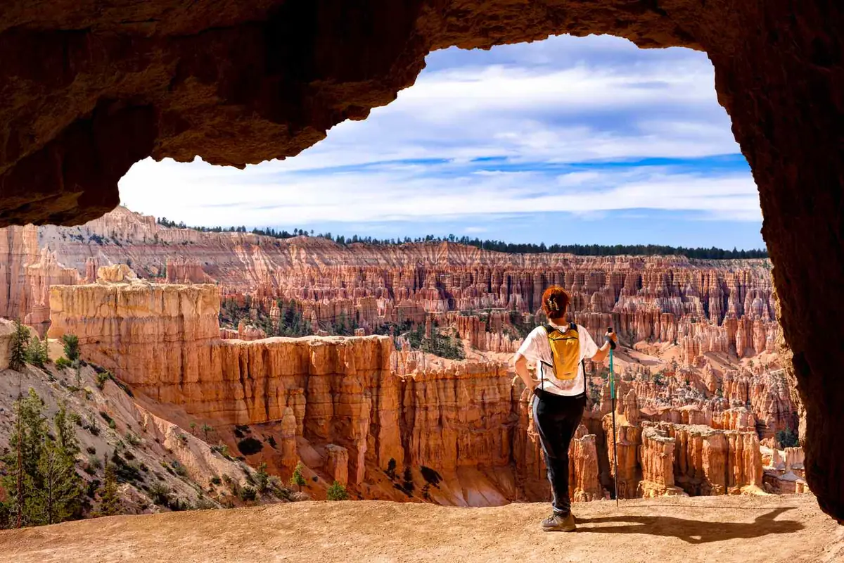 Hiker overlooking a red rock canyon